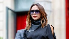 a headshot of victoria beckham wearing sunglasses