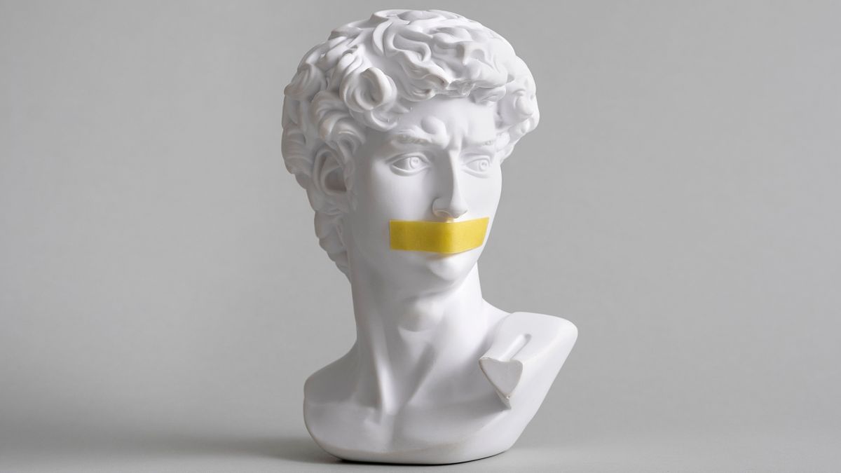 Michelangelo&#039;s &#039;David&#039; head bust, with a piece of yellow tape covering the mouth.