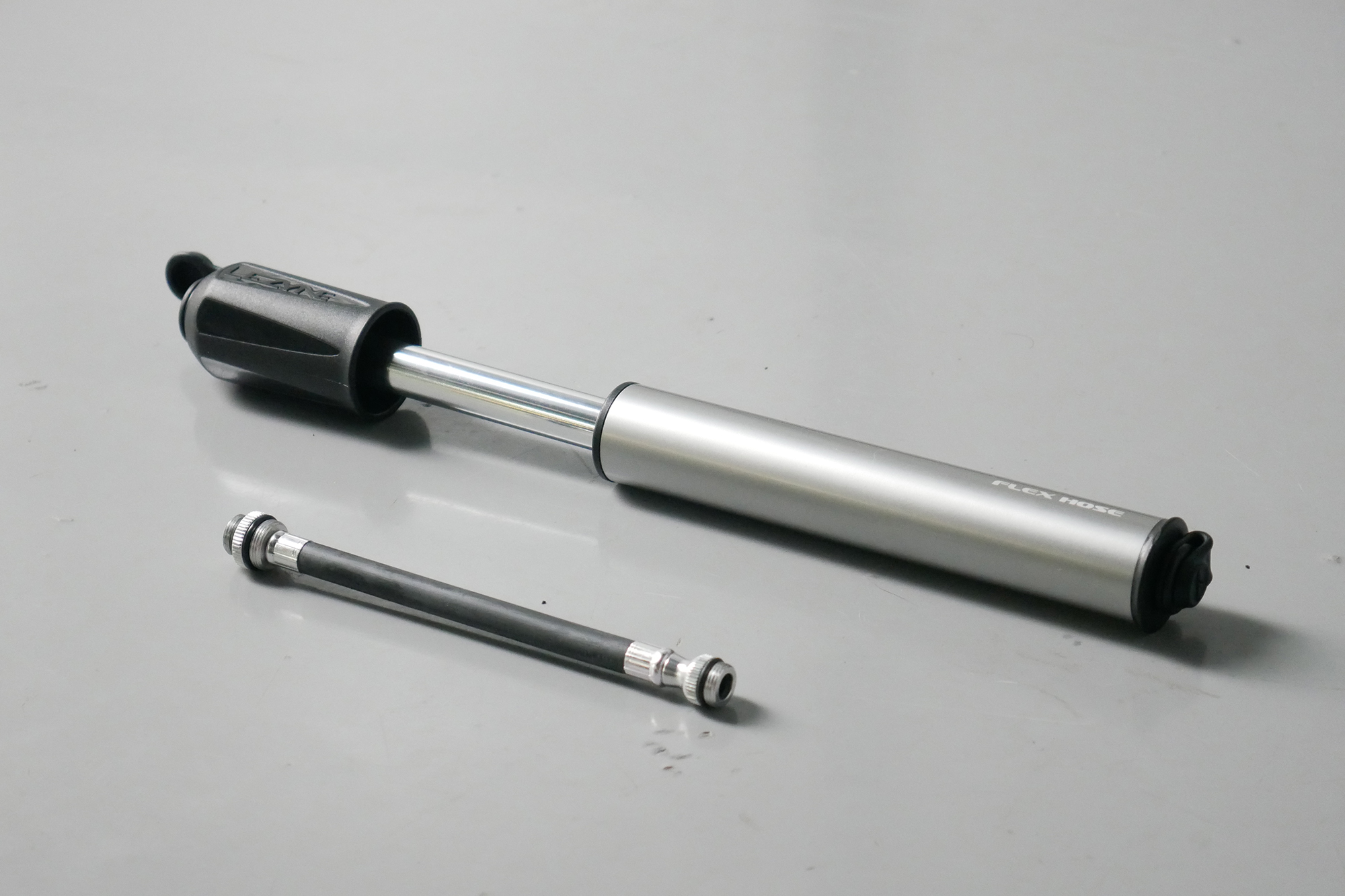 Best bike mini pumps group test 2026 - Lezyne Sport Drive sat next to its flexible hose