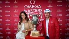 Thriston Lawrence of South Africa poses with the trophy alongside Cindy Crawford, Model and TV personality following victory on day four of the Omega European Masters at Crans-sur-Sierre Golf Club