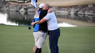 Sepp Straka celebrates his victory at The American Express by embracing his caddie