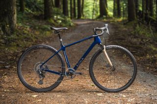 Kona Ouroboros Supreme gravel bike side on in woods