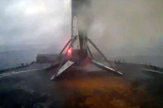 A SpaceX Falcon 9 rocket's first stage is seen after touching down on the droneship "A Shortfall of Gravitas" off the coast of Florida on Sunday, Jan. 7, 2024.