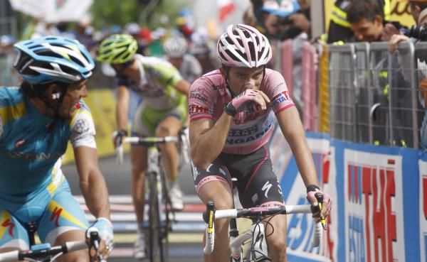 Paolo Tiralongo (Astana) looks back at Alberto Contador (Saxo Bank-SunGard) on crossing line.