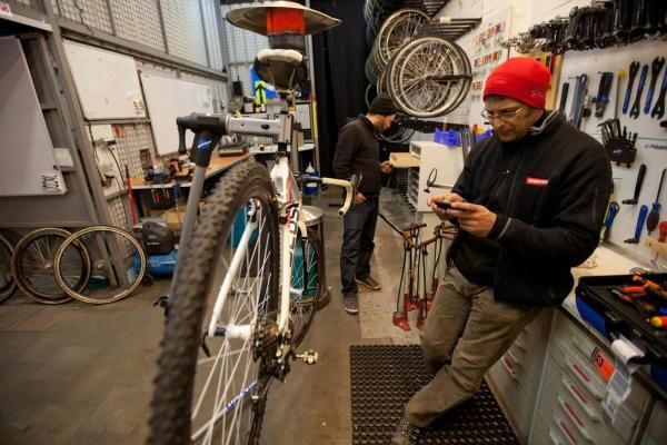 Todd, one of the Euro Cross Camp mechanics, preps bikes for the next day's racing.