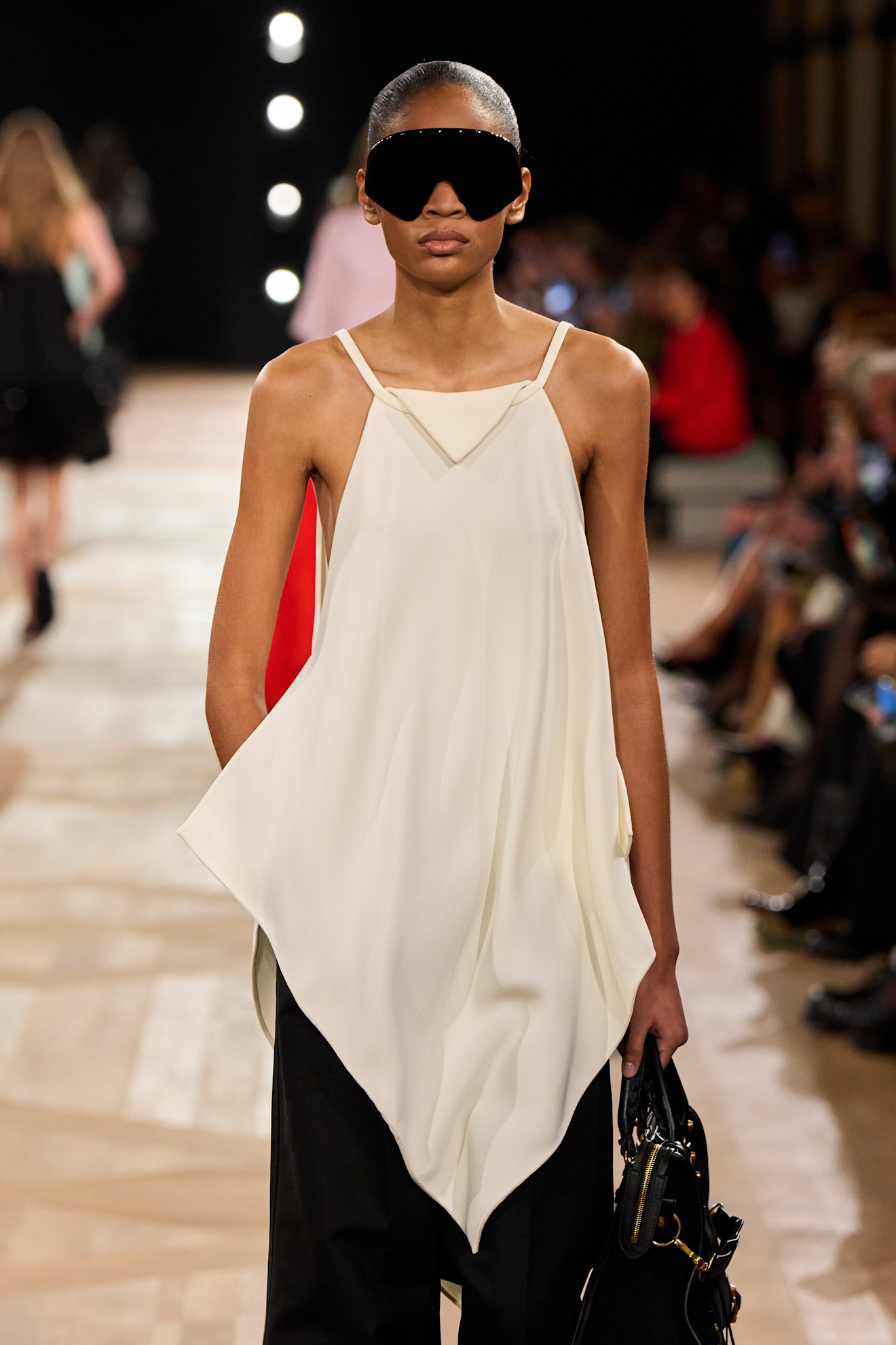 Photos of runway models wearing bug-eye sunglasses during the Spring Summer 2026 season.