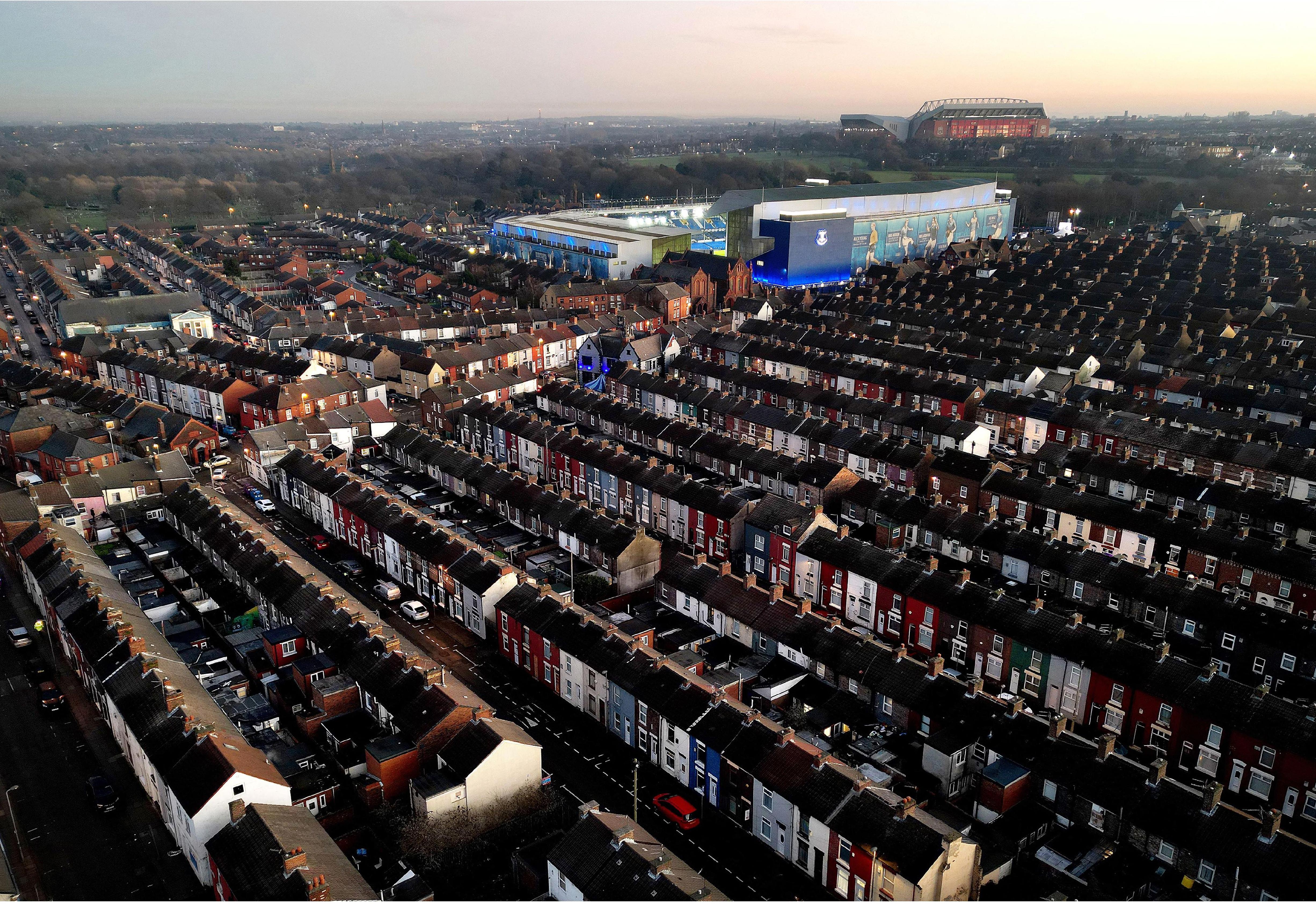 Aerial view of brick-terraced houses leading to Goodison Park, highlighting the nostalgic architecture of the stadium in the context of the surrounding neighborhood.