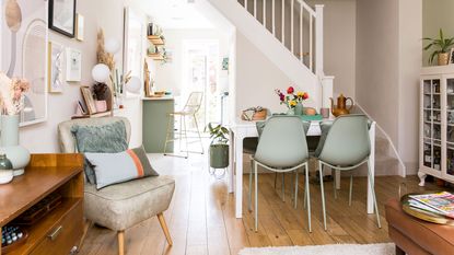 open plan dining room with table and armchair