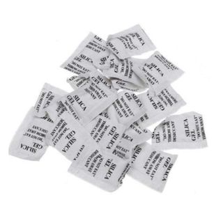 25 silica gel packets with writing on them on a white background