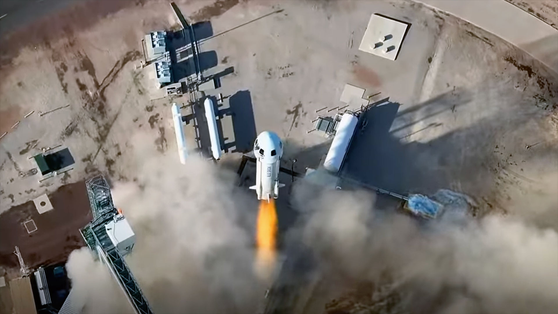 a drone&#039;s eye view of a rocket taking from its launch pad