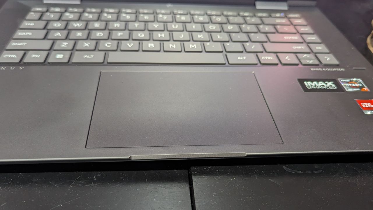 A close up of the trackpad on a laptop.