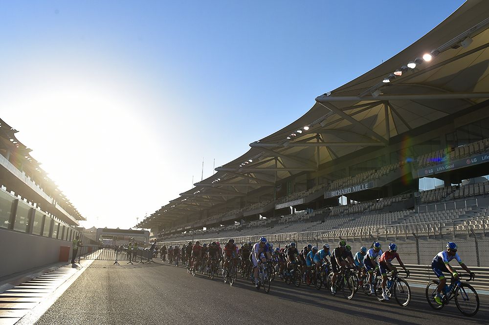 The sun sets on the peloton in Abu Dhabi.