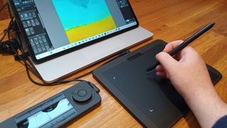 Xencelabs Pen Tablet Small review; a small drawing tablet is connected to a laptop