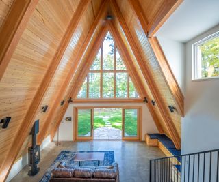 interior showing the dramatic roof structure at Lake Placid A-Frame by Strand Design