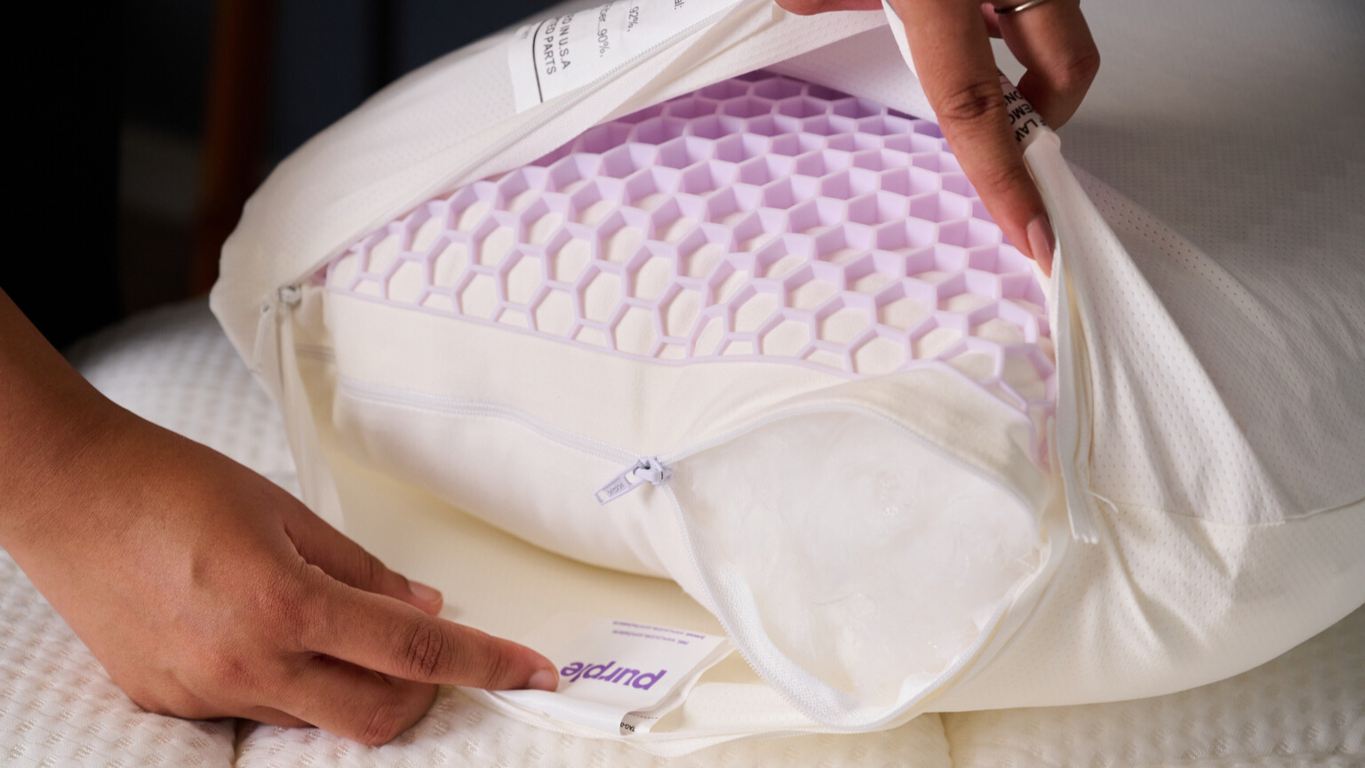Hands showing the inner layers of the GridCloud pillow