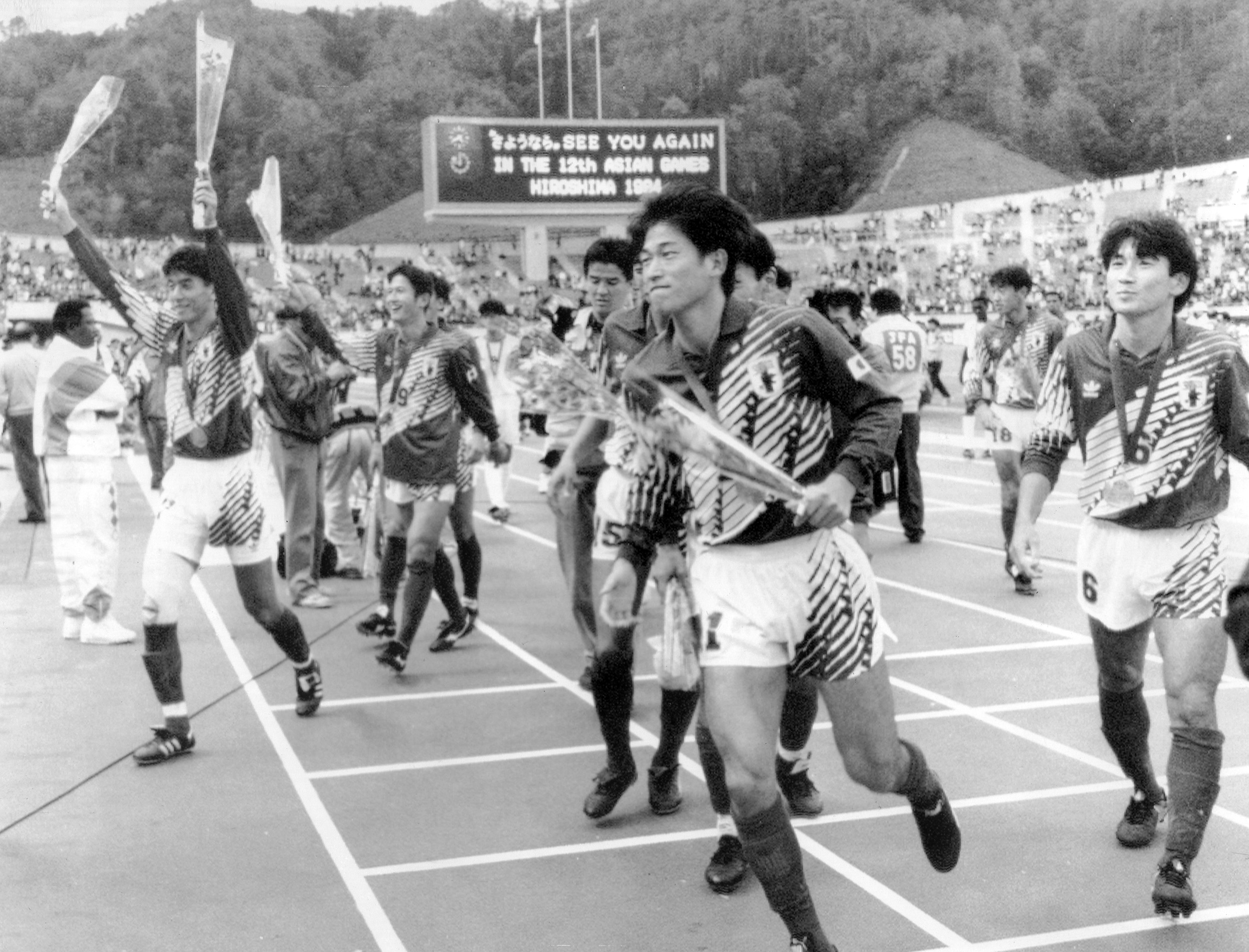 Japan players celebrate after winning the Asian Cup final against Saudi Arabia in Hiroshima in November 1992.