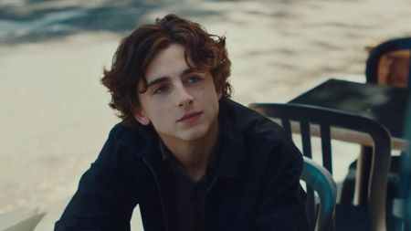 Timothée Chalamet looking up and admiringly at someone in Lady Bird.