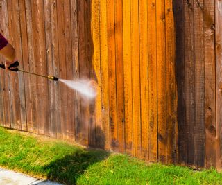 Pressure washing a fence