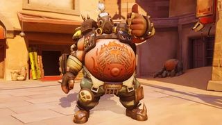 Overwatch's Roadhog puts his thumb up for the camera