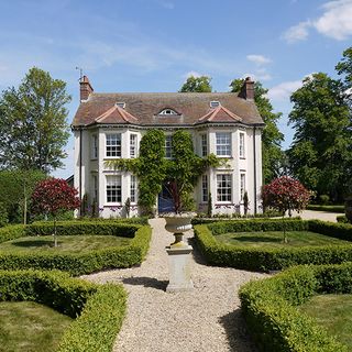 Orchard House Tyringham near London exterior shot with gardens in the foreground