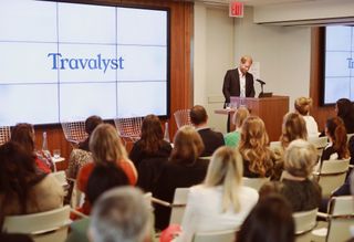 Prince Harry speaking into a mic at a Travalyst event