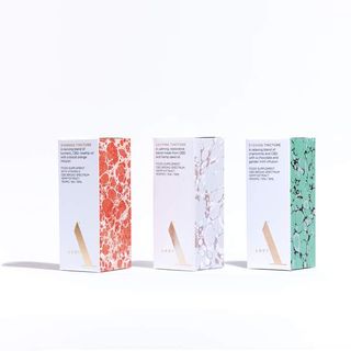 Lady A female focused CBD tinctures in white boxes with marbling decoration