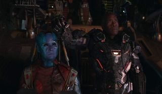 Avengers: Endgame Nebula and Rhodey look up with stern expressions