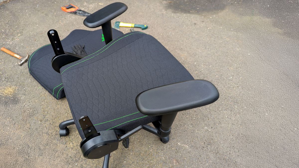 Razer Iskur V2 X gaming chair set-up outside with some Razer branded gloves!