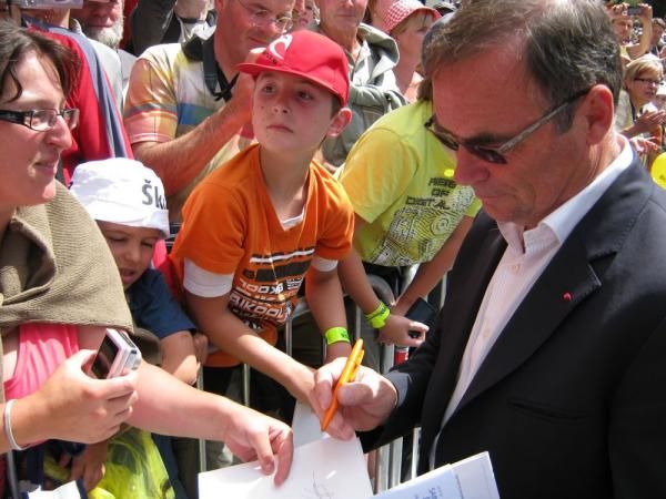 Five-time Tour de France winner Bernhard Hinault signs an autograph