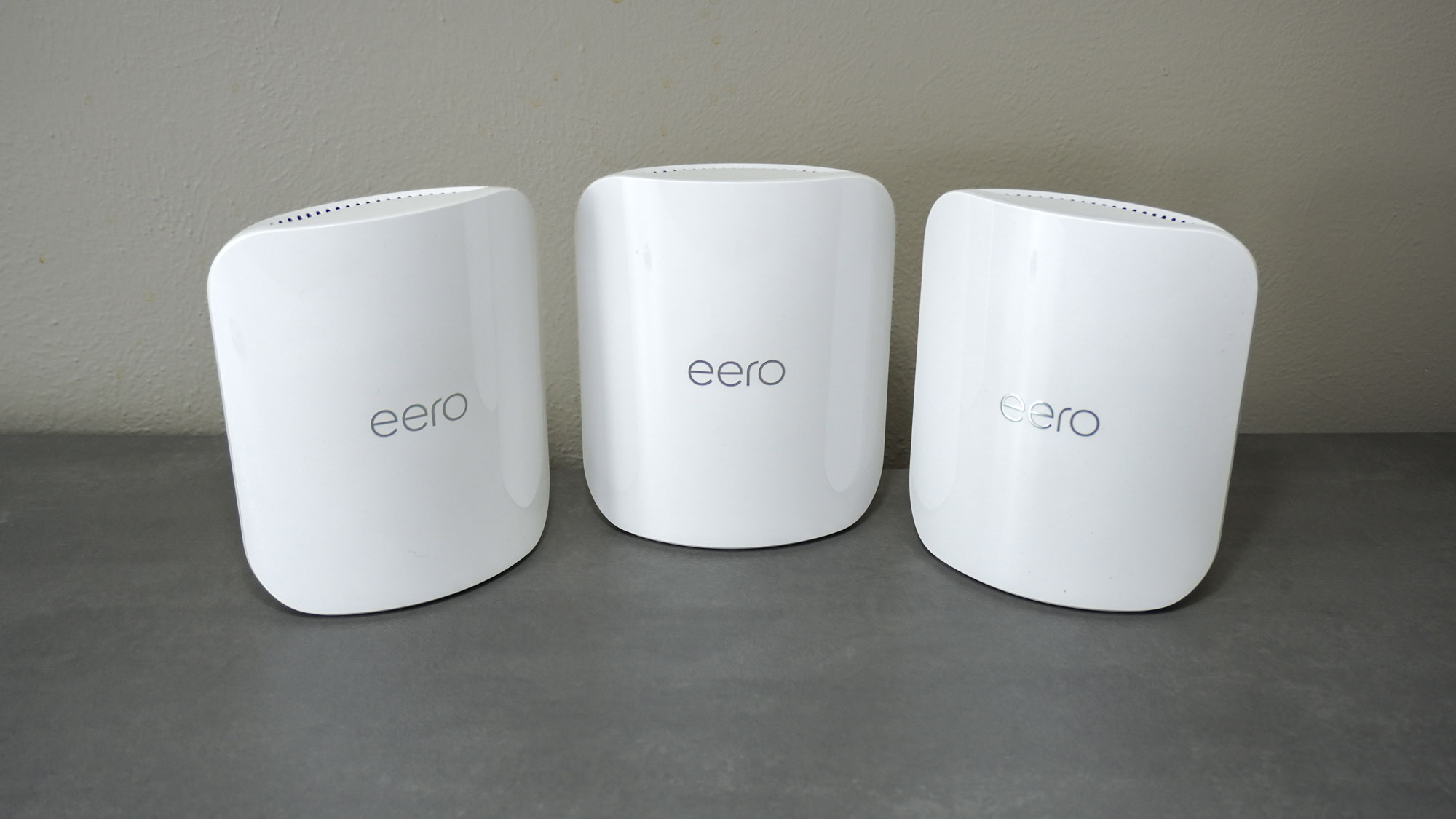 The eero Pro 7 mesh Wi-Fi system in a three-pack on a desk