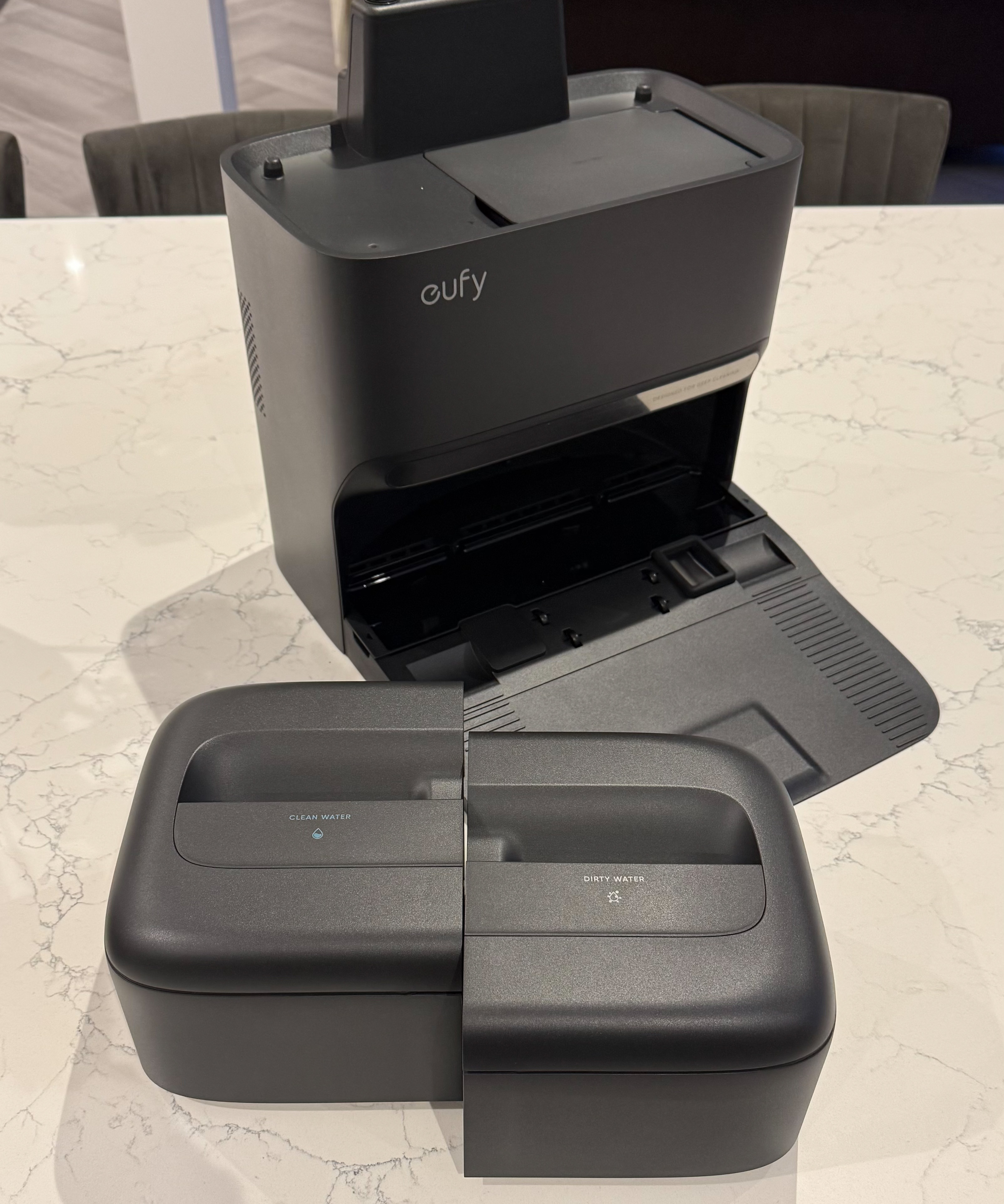 Eufy Omni C28 clean and dirty water tanks placed in front of base station