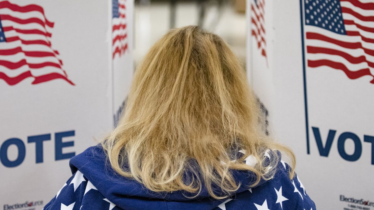 A woman votes during Super Tuesday in the US presidential primaries.