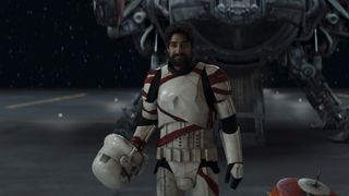 Still from season 1 of the Star Wars TV show Ahsoka. Ezra returns (human male with short dark hair and a full dark beard). He is wearing white stormtrooper's armor, wrapped here and there with red tape. He has just removed his helmet.