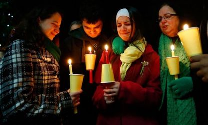 Donna Soto, far right, along with her children Jillian, far left, Matthew, and Karly, mourn for her other daughter Victoria Soto, a 1st-grade teacher who was killed at Sandy Hook Elementary S