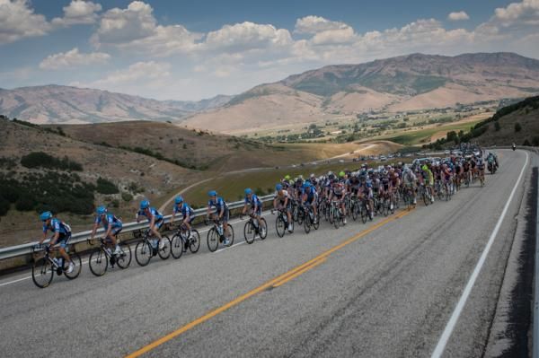 The Garmin-Sharp team gets the bunch strung out heading into the first climb.