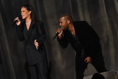 Kanye West performs with Rihanna.