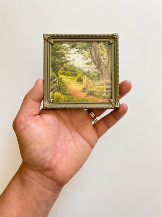 miniature landscape art in a vintage style frame