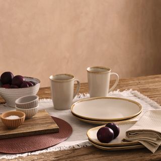 dining table with dinner platters and napkins