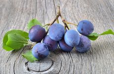 Ripe Langley Bullace Damson Plums Sitting On Wooden Table