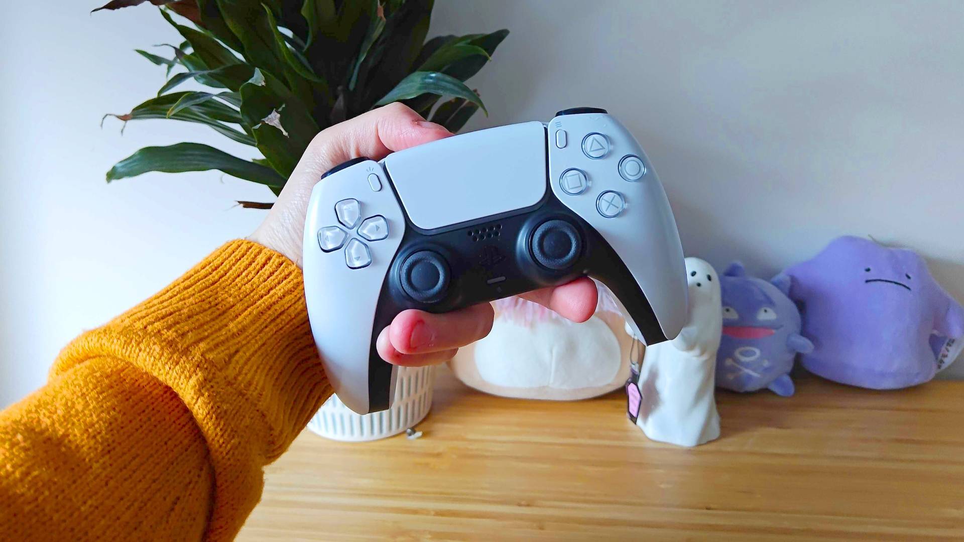 Image of writer Phil Hayton holding a PS5 DualSense controller.