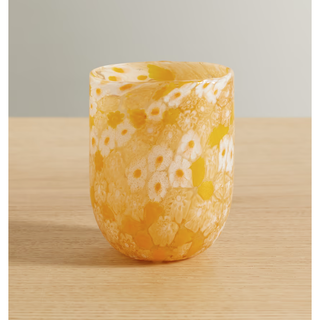 yellow water glass with a floral design