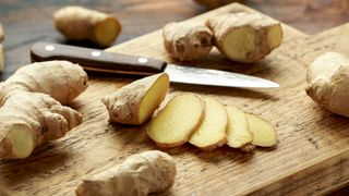 Sliced root ginger on a chopping board