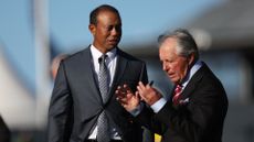 Tiger Woods of the United States and Gary Player of South Africa talk before the Past Champions Dinner prior to The 150th Open at St Andrews Old Course
