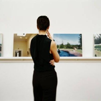 Woman looking at art