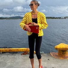 nina sandbech wearing a red bag