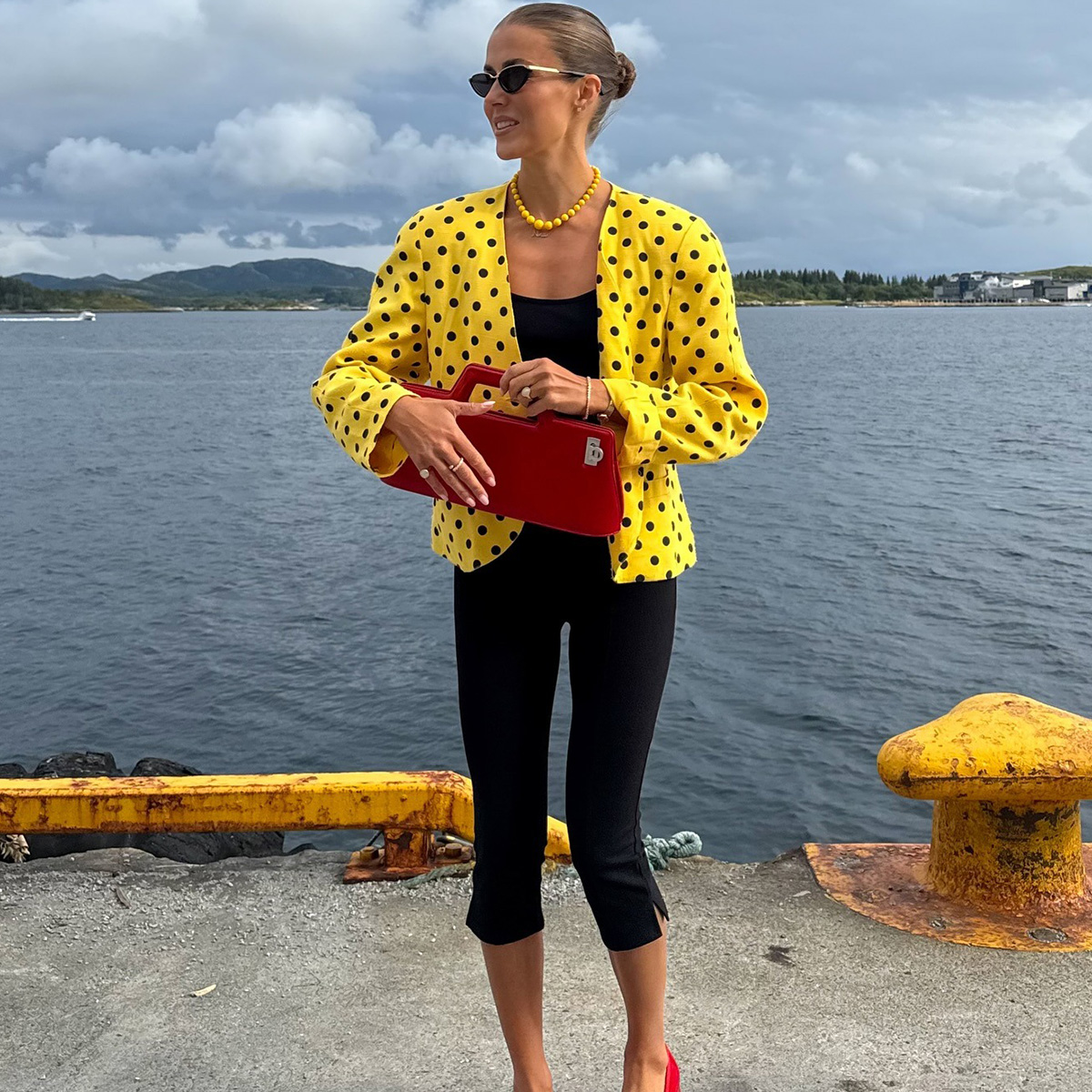 nina sandbech wearing a red bag