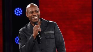 Dave Chappelle in a production still from his Netflix stand-up special 'Dave Chappelle: Sticks Stones'