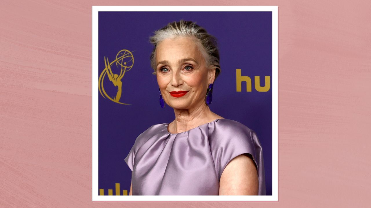 Kristin Scott Thomas wears a purple dress and red lipstick at the 76th Primetime Emmy Awards at Peacock Theater on September 15, 2024 in Los Angeles, California/ in a dark pink template