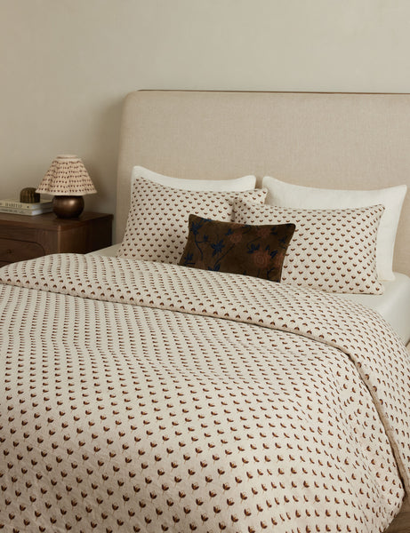 Lulu and Georgia Poiret European Flax Linen&amp;reg; Duvet Cover with matching pillows, cream upholstered headboard and woode bedside table with lamp.