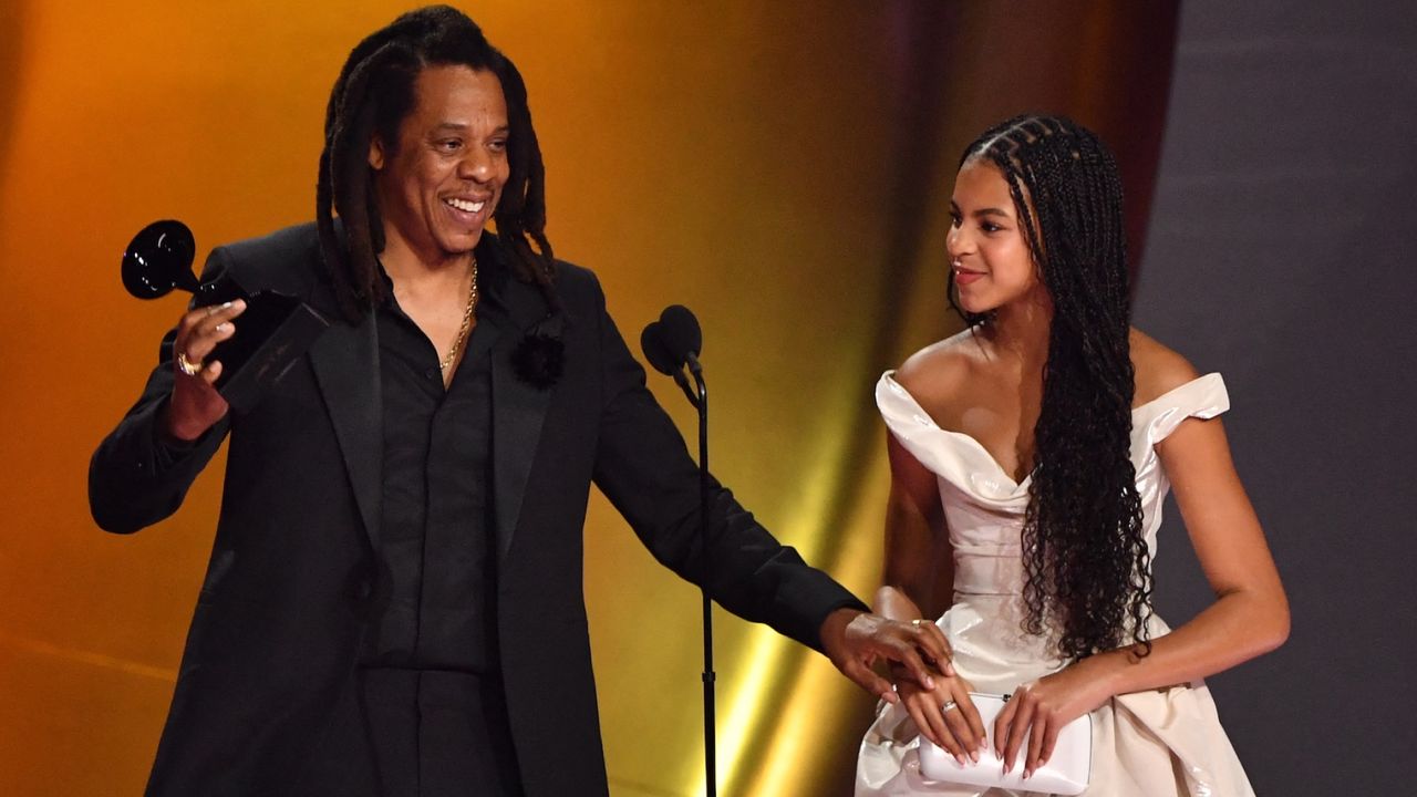 US rapper Jay-Z (L) accepts the Dr. Dre Global Impact Award alongside his daughter Blue Ivy (R) on stage during the 66th Annual Grammy Awards